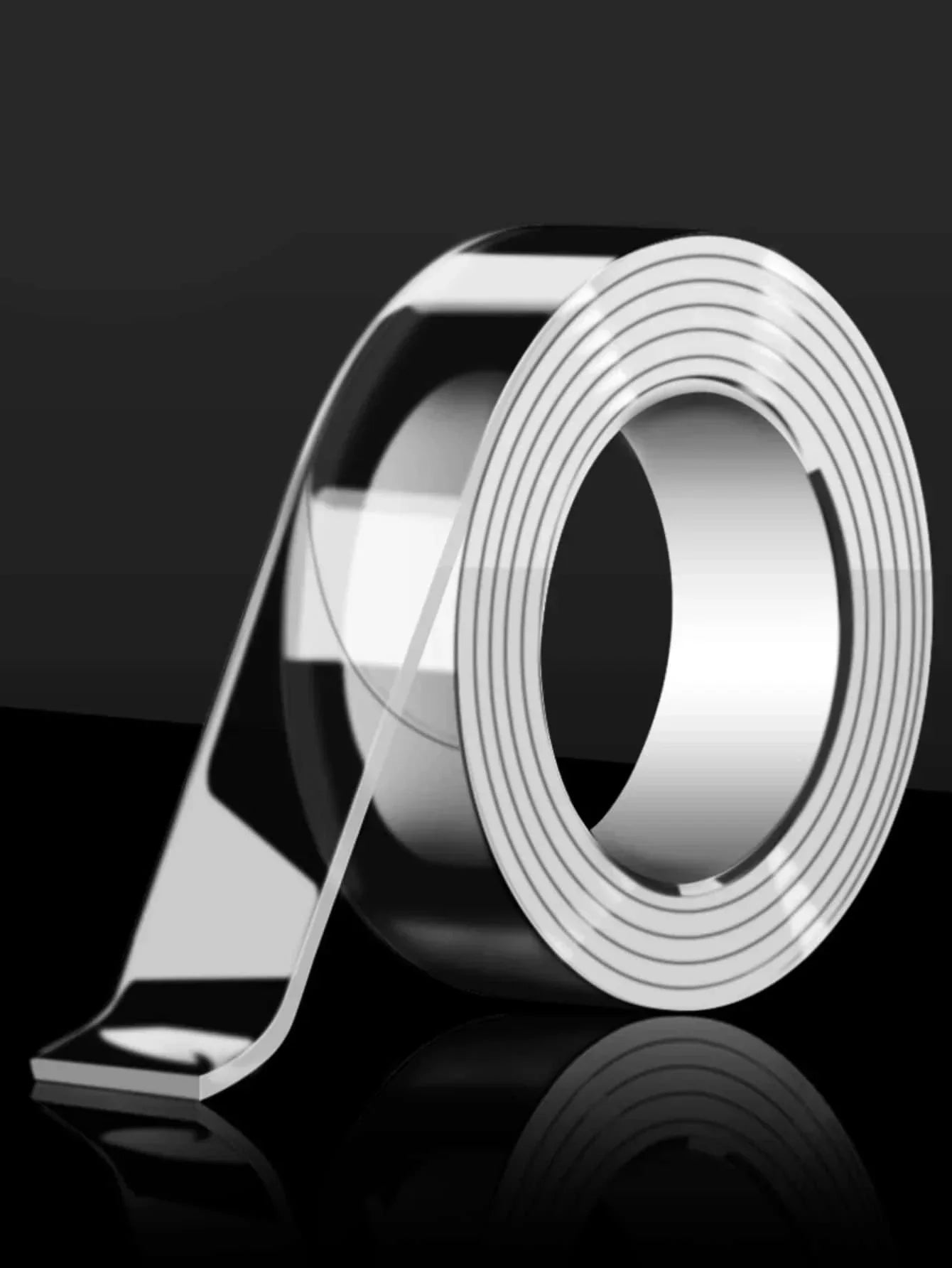Clear roll of reusable double sided tape with strong adhesive for multi-surface use